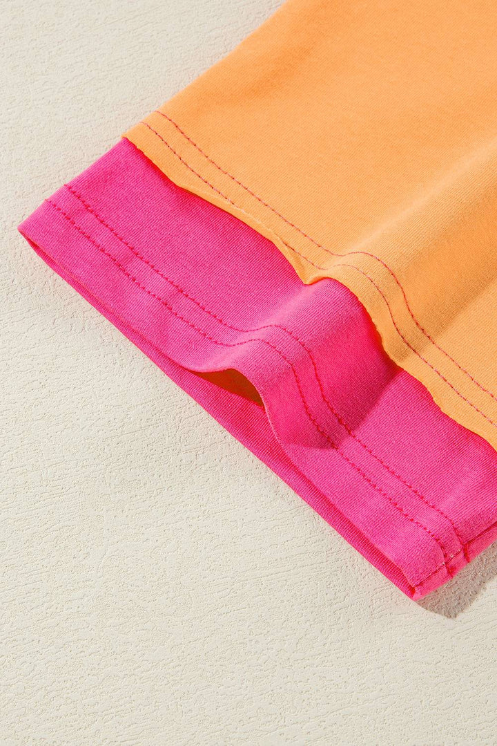 a close up of a pink and orange shirt