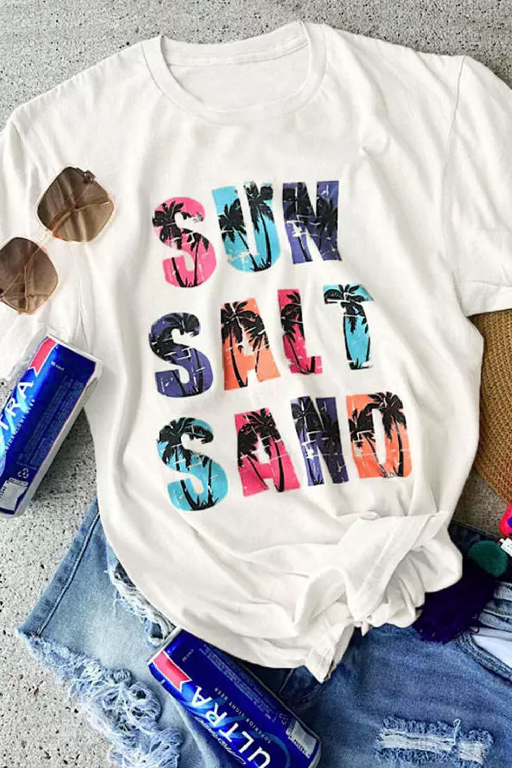 a t - shirt that says sun, sand, and palm trees on it
