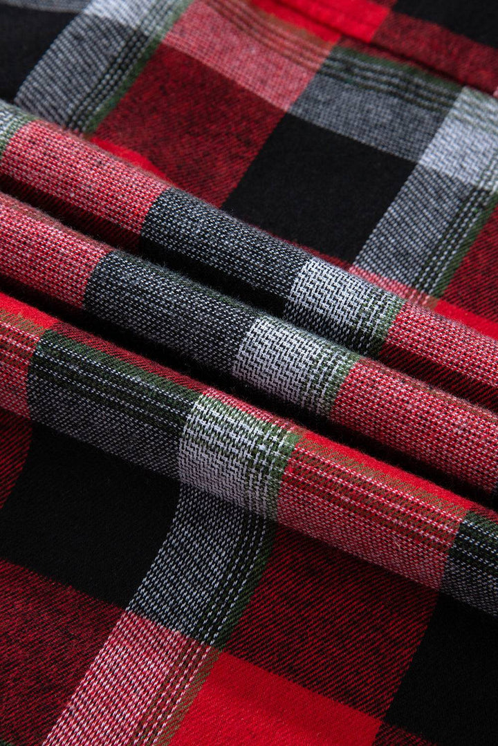 a close up of a red and black plaid fabric