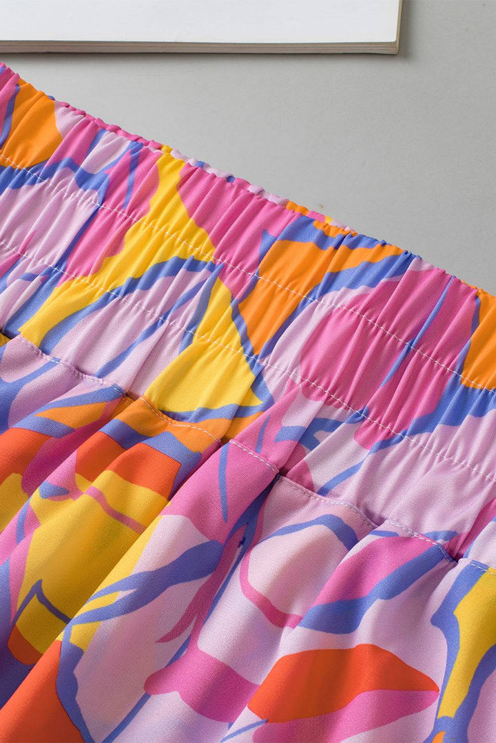 a close up of a colorful skirt on a bed