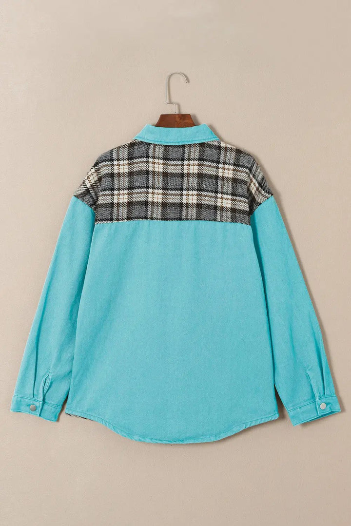 a blue shirt with a check pattern on the back