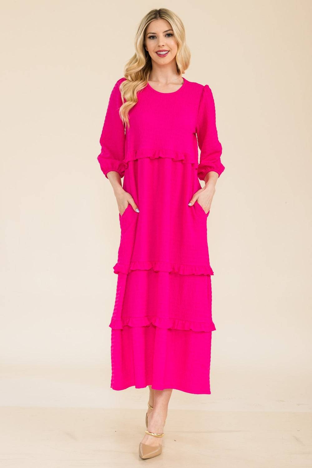 a woman wearing a bright pink dress