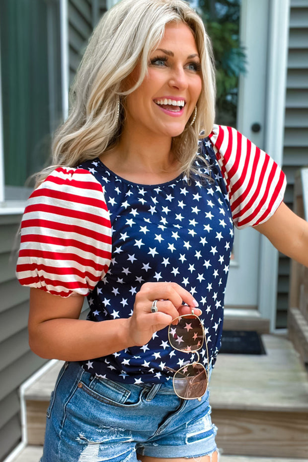 a woman in a patriotic shirt and ripped shorts