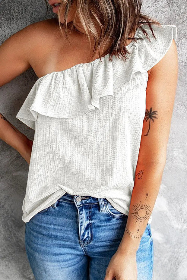 a woman wearing a white top with a palm tree tattoo on her arm