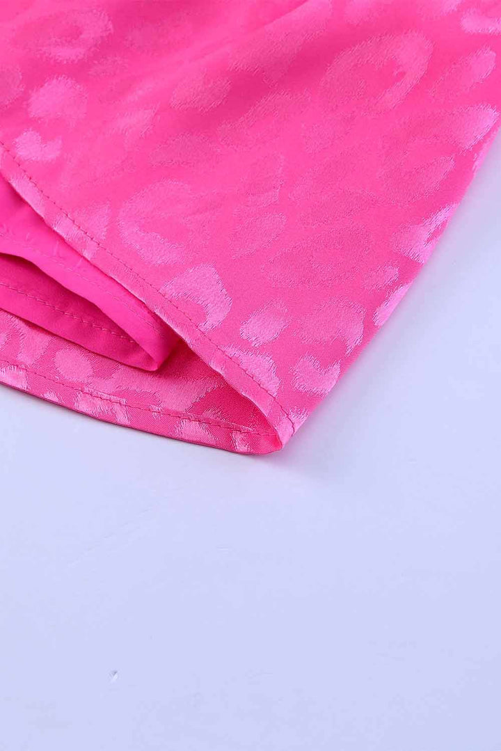 a close up of a pink fabric on a white surface