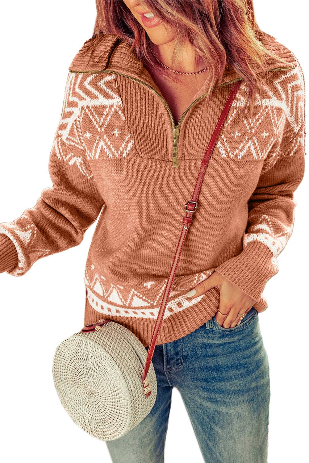 a woman wearing a brown sweater and a white hat