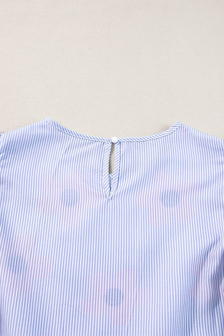 a close up of a blue and white striped shirt