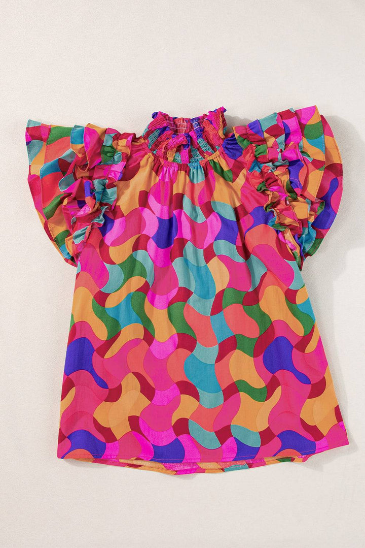 a child's blouse with colorful circles on it