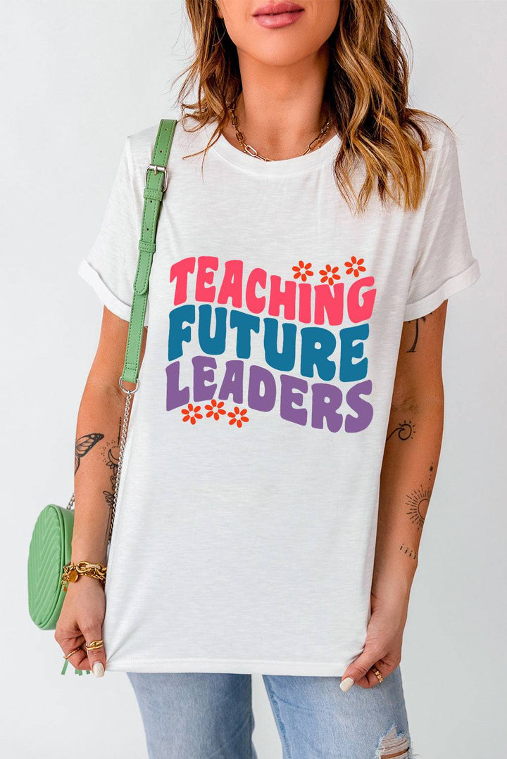 a woman wearing a t - shirt that says teaching future leaders