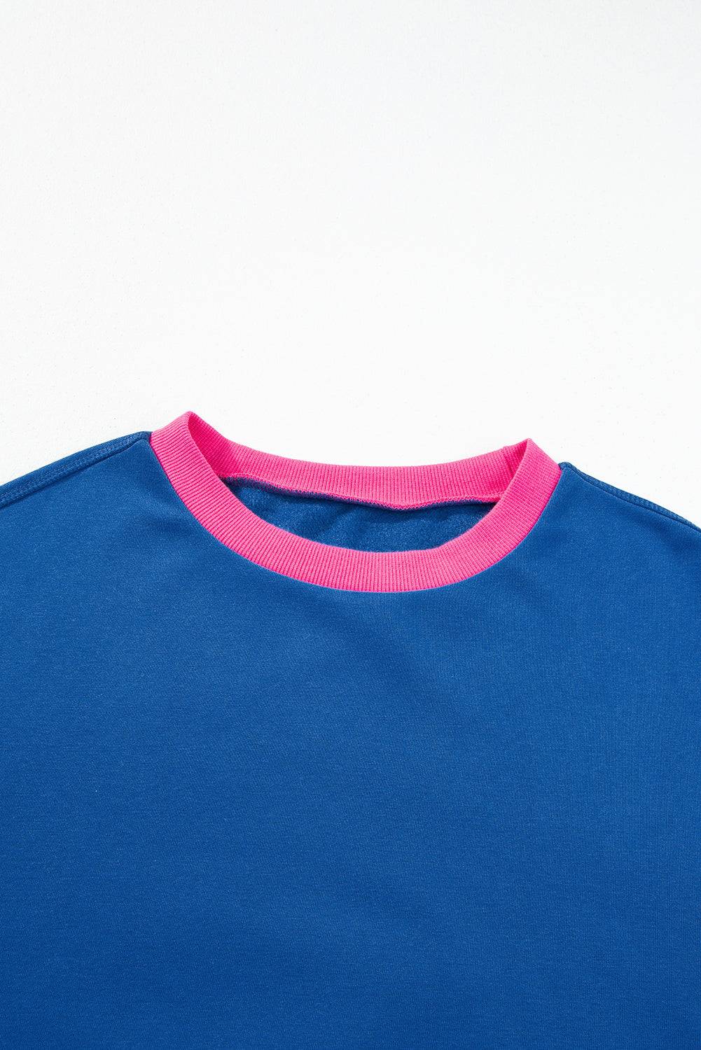 a blue t - shirt with a pink trim