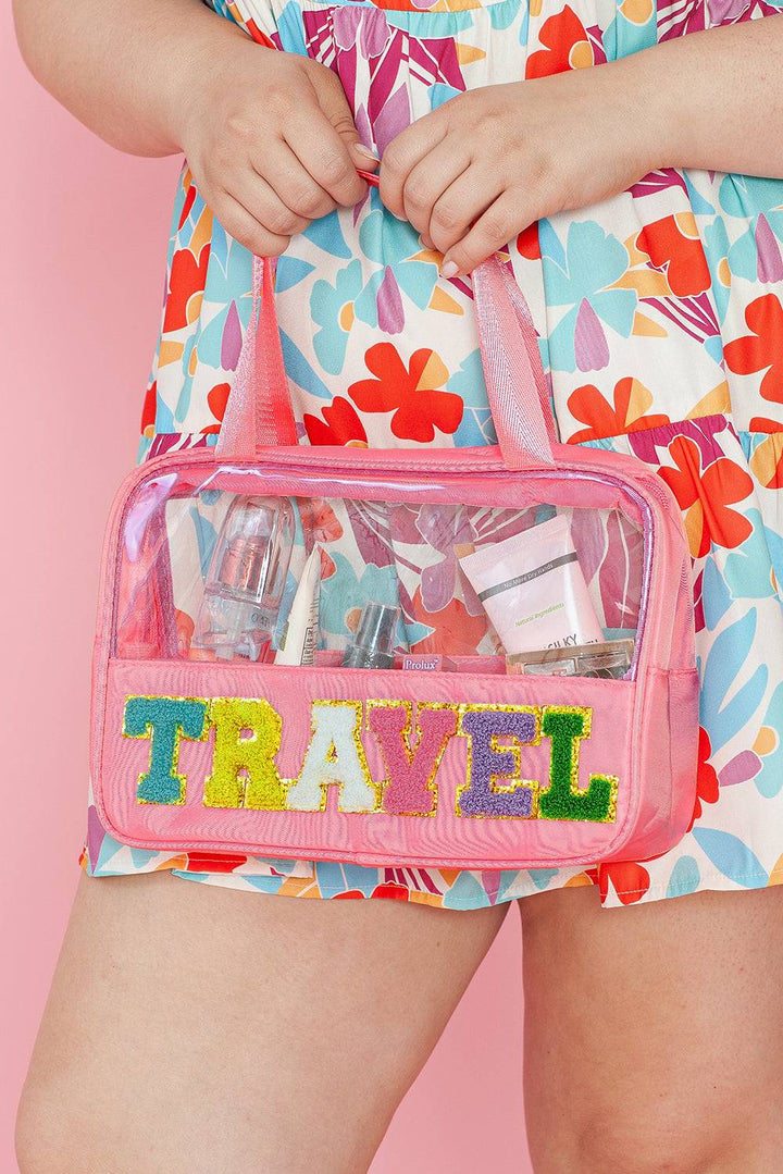 a woman is holding a pink travel bag