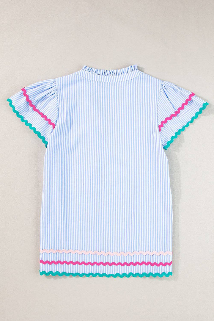 a blue and white striped shirt with pink trim