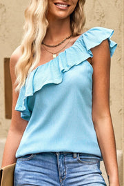 a woman with blonde hair wearing a blue top