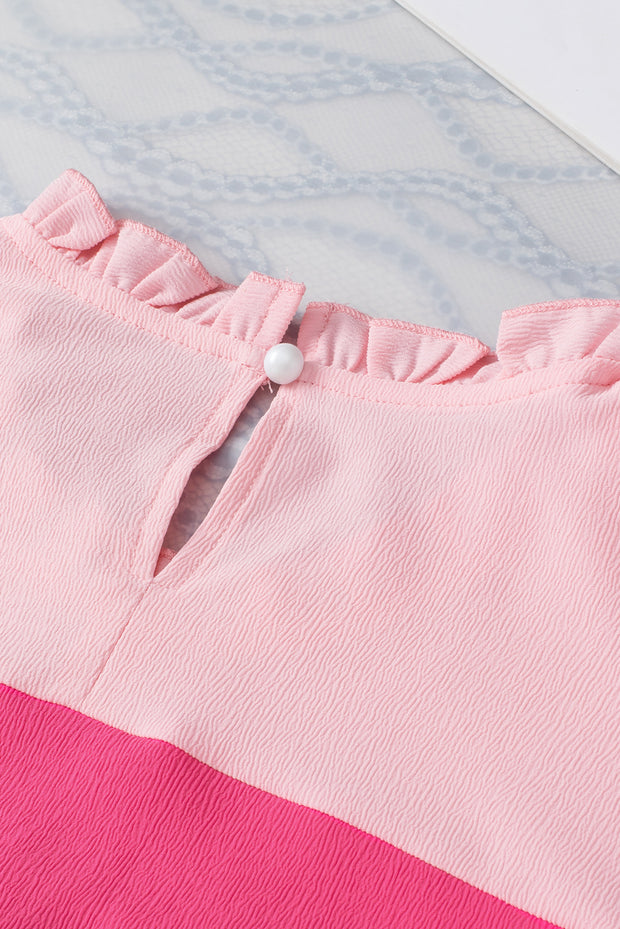 a close up of a pink and white shirt
