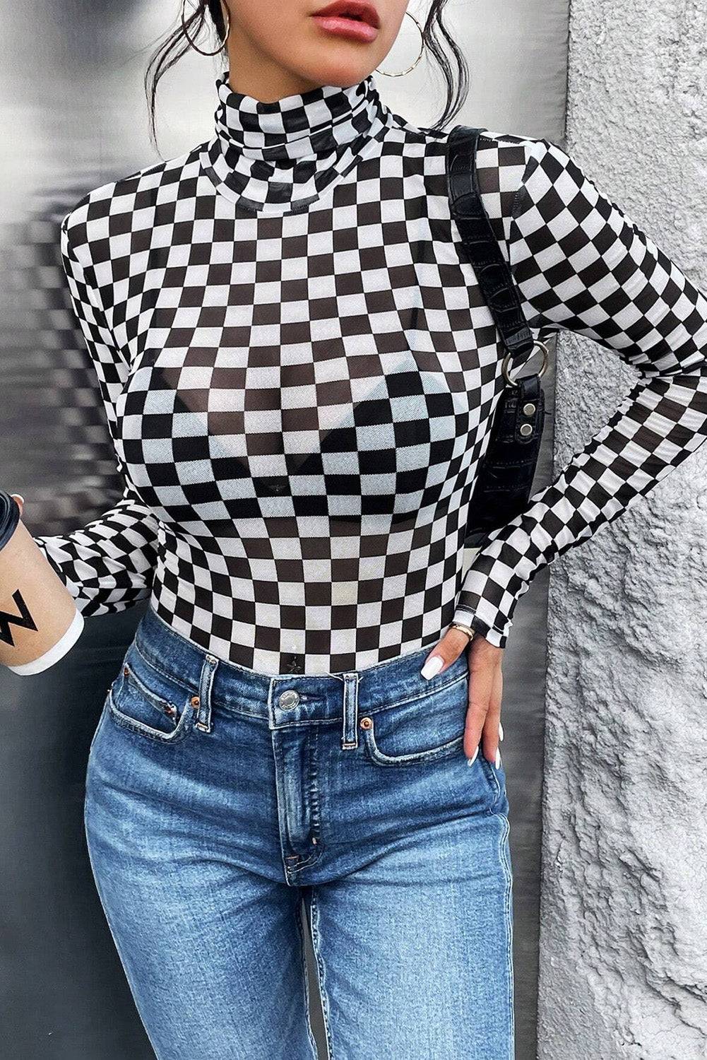 a woman wearing a black and white checkered shirt