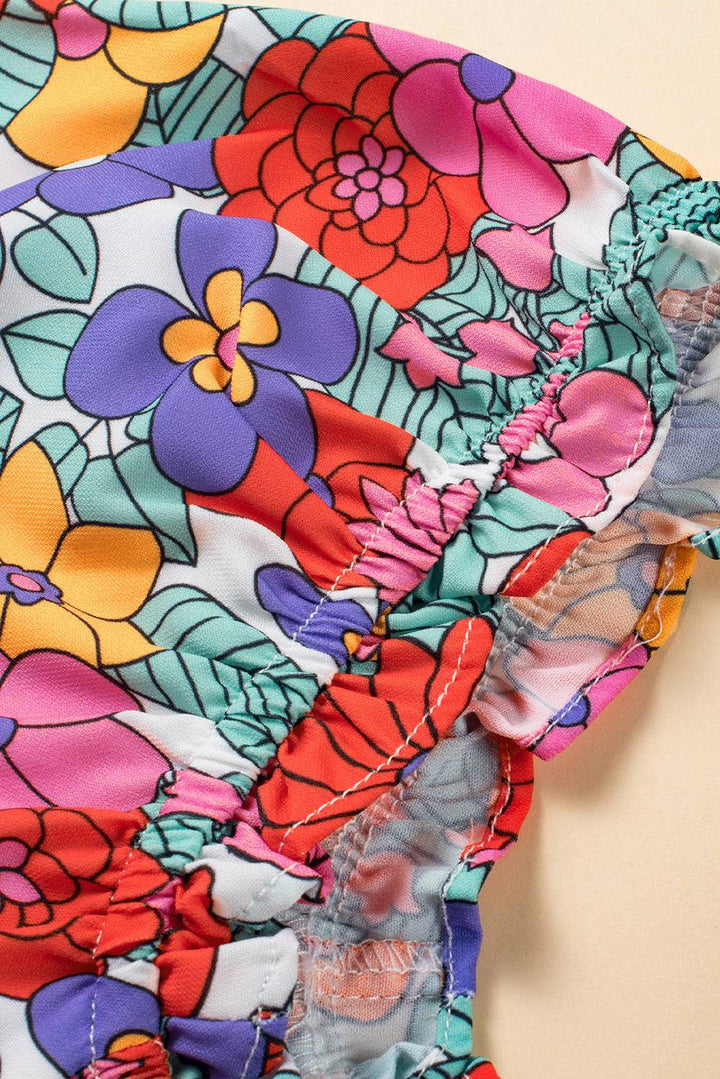 a close up of a dress with flowers on it