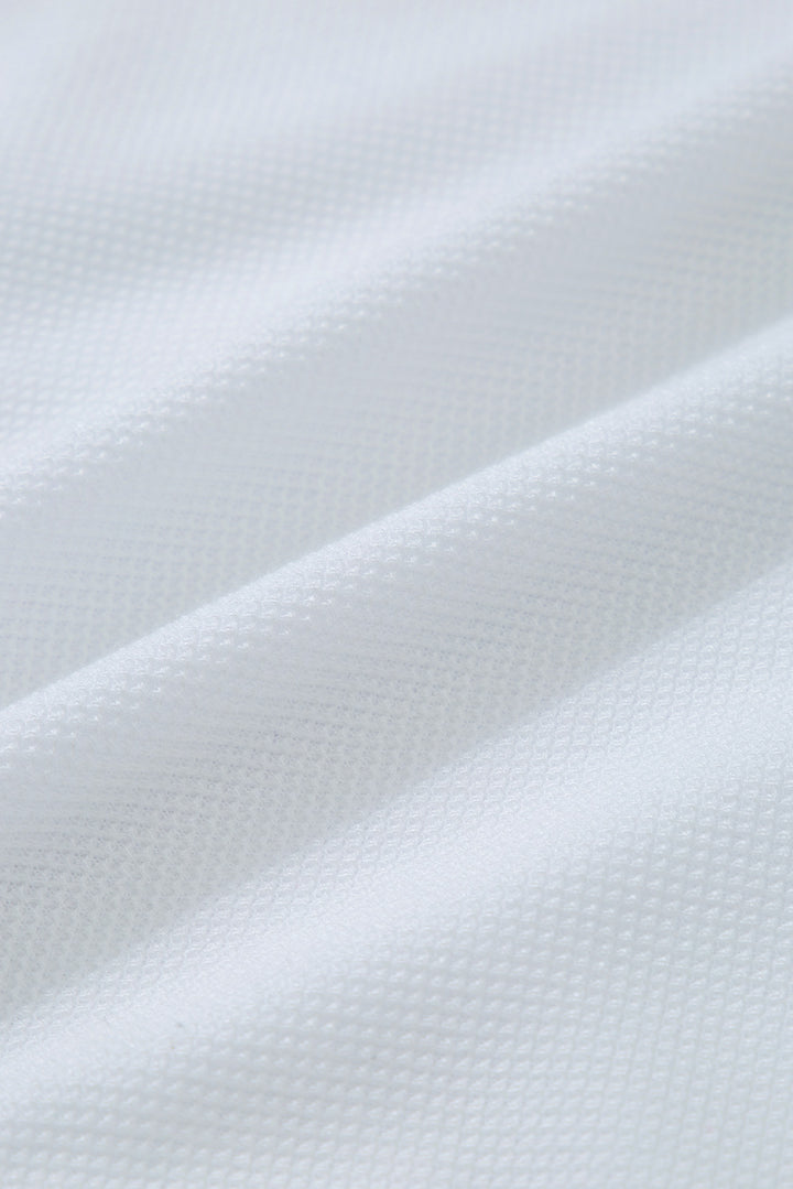 a close up view of a white fabric