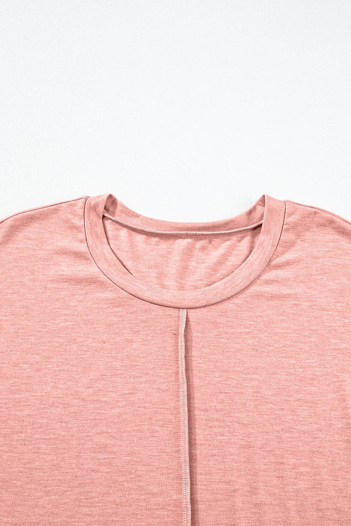 a close up of a pink shirt on a white background