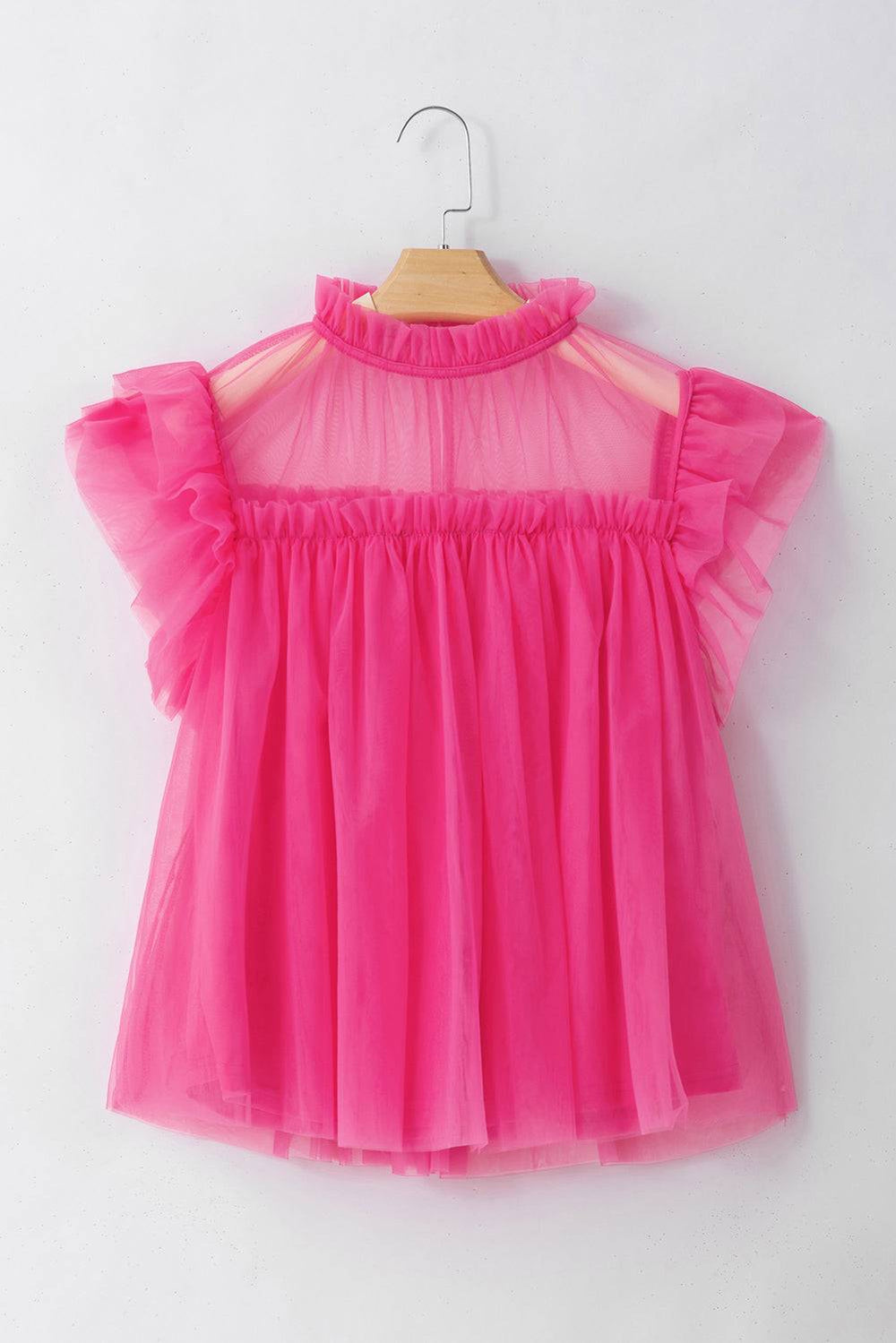 a pink dress hanging on a hanger