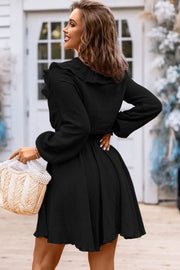 a woman in a black dress holding a basket