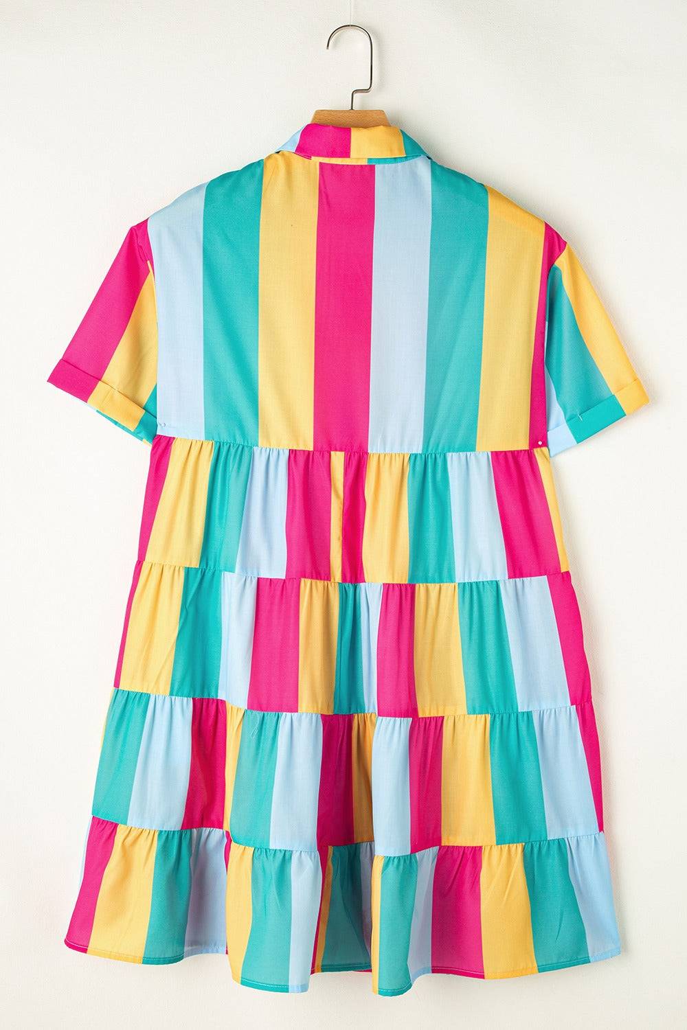 a colorful dress hanging on a hanger