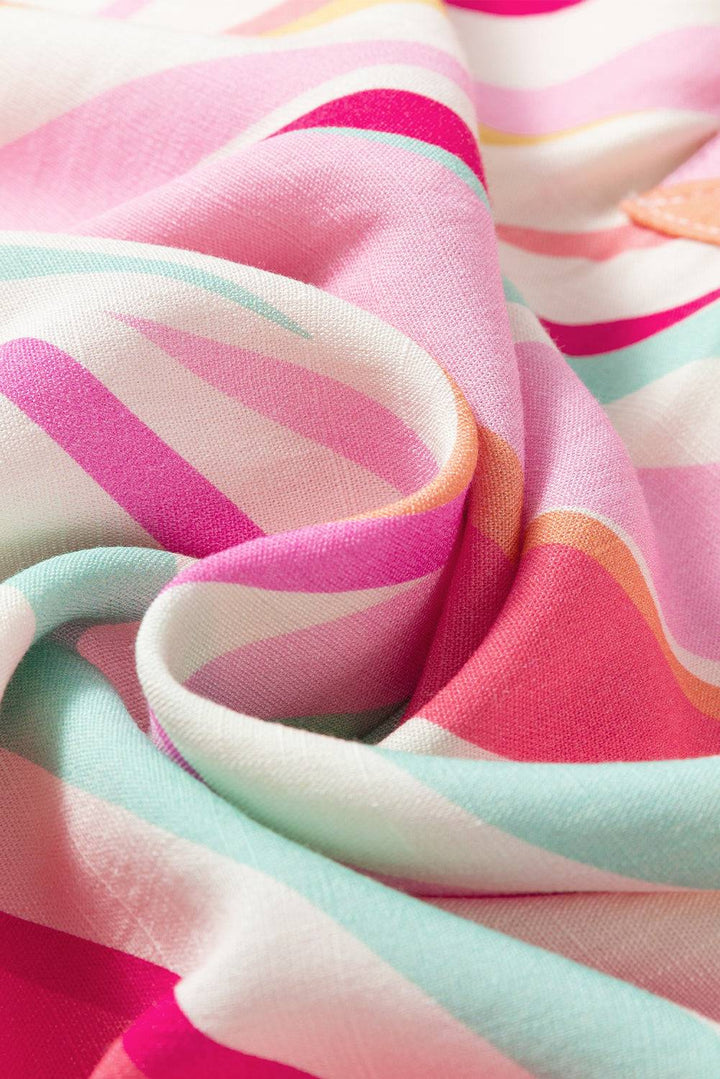 a close up of a pink and blue striped fabric