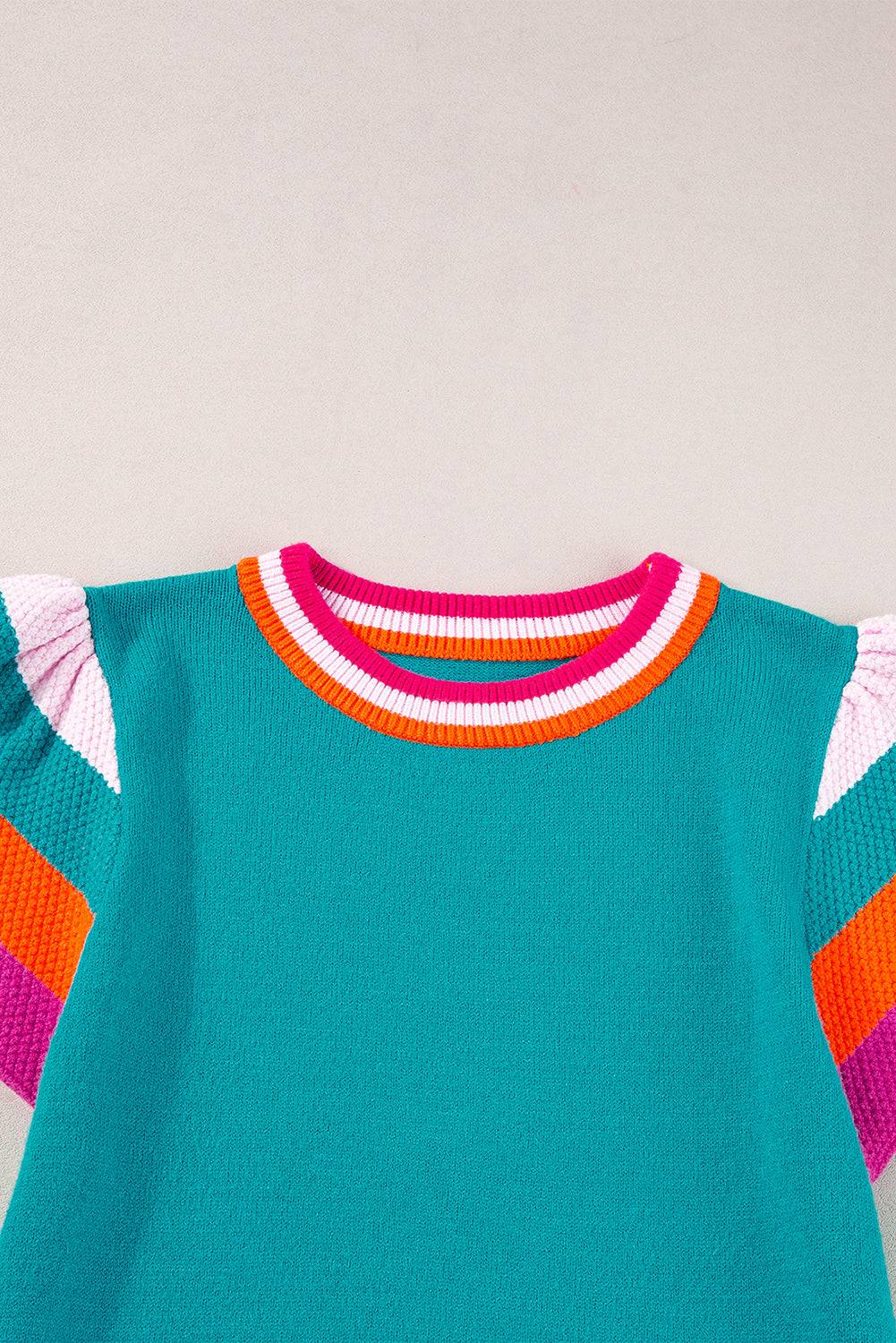 a green shirt with a pink, orange, and blue stripe