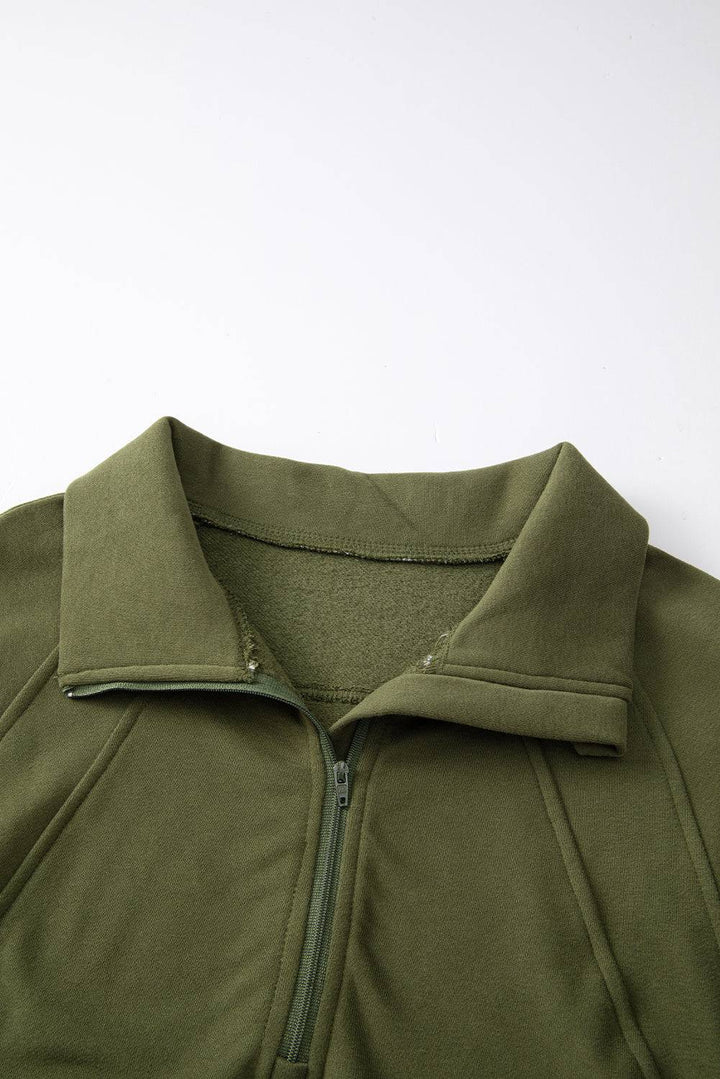 a close up of a green jacket on a white background