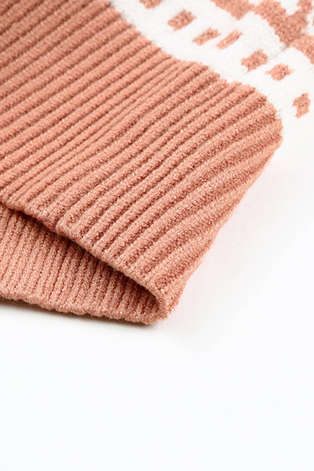 a close up of a sweater on a white surface