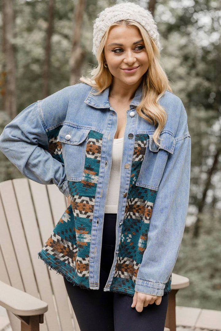 a woman standing on a deck wearing a jean jacket