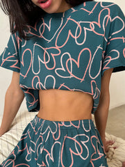 a woman wearing a crop top and skirt