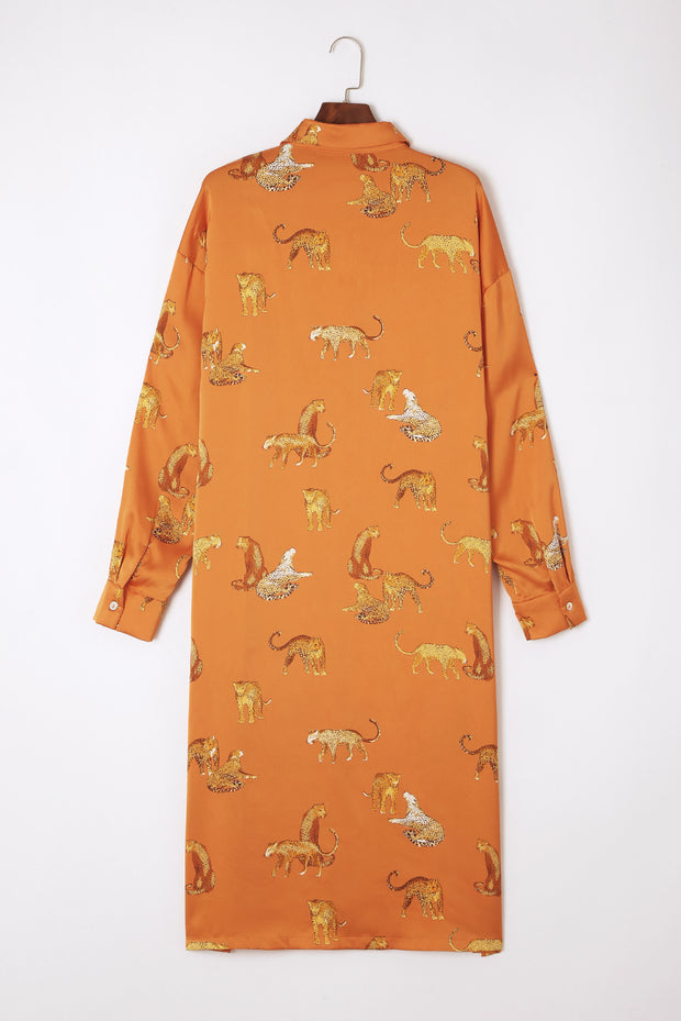 an orange shirt with a pattern of cats on it