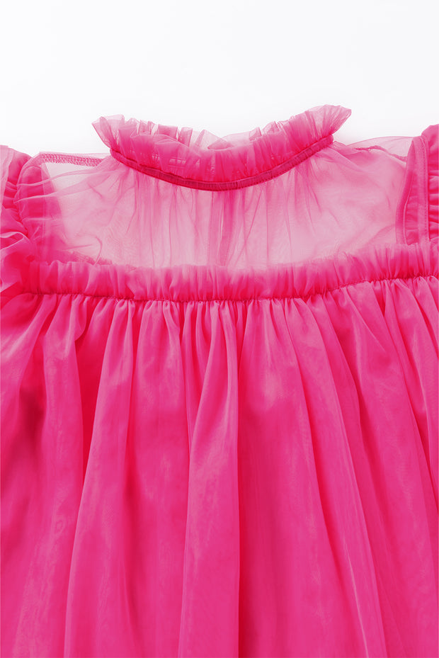 a close up of a pink dress on a white background