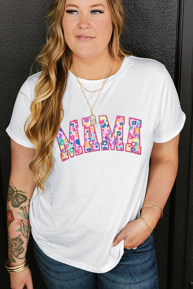 a woman wearing a white shirt with the word mama on it