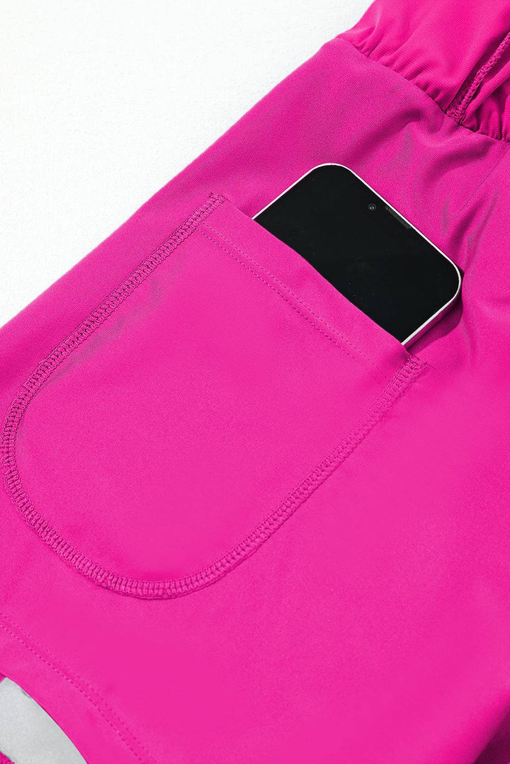a cell phone is in the pocket of a pink pants