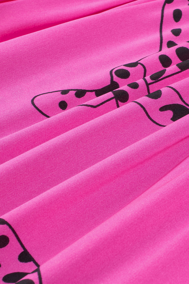 a pink sheet with a black bow on it