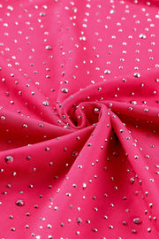 a close up of a pink fabric with silver sequins