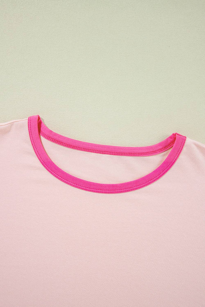 a pink t - shirt with a pink ribbon around the neck