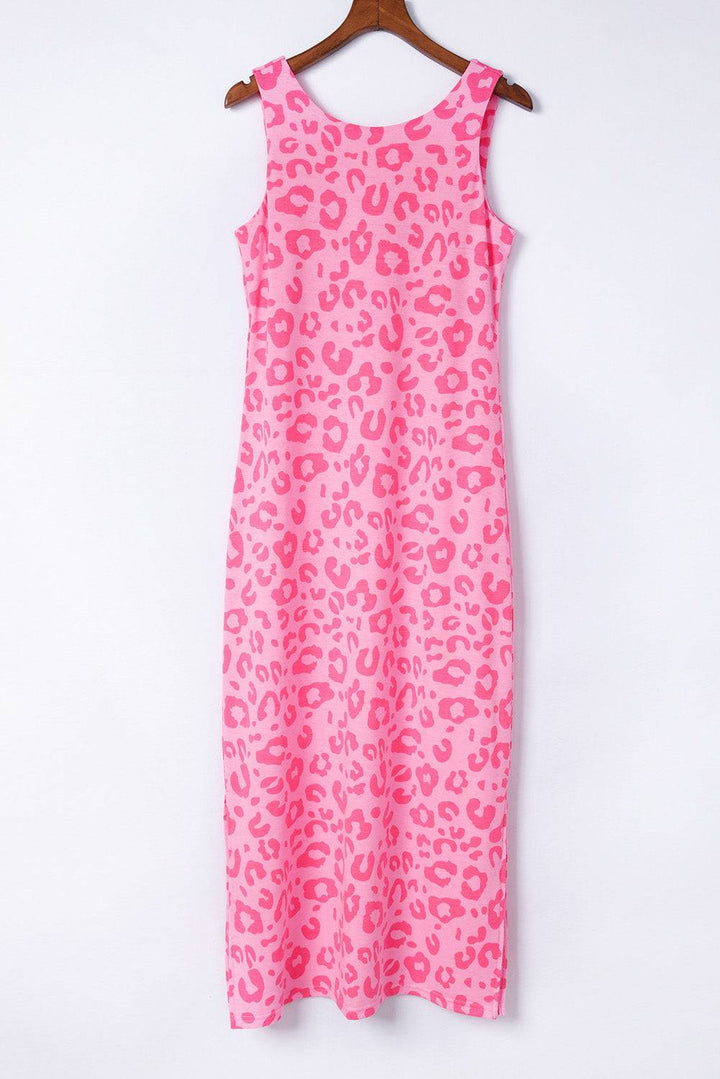 a pink leopard print dress hanging on a hanger