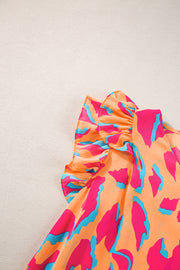 an orange and pink dress with blue and pink designs