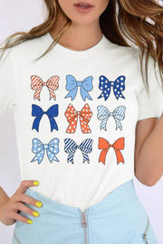 a woman wearing a t - shirt with bows on it