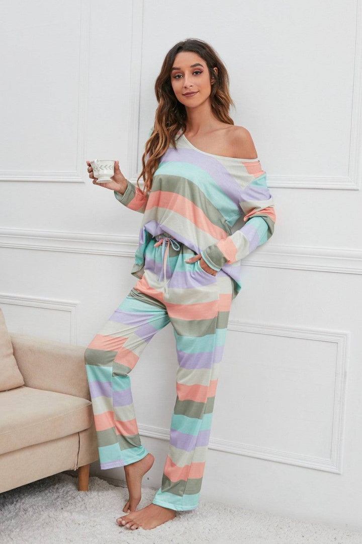 a woman in a colorful striped pajama set