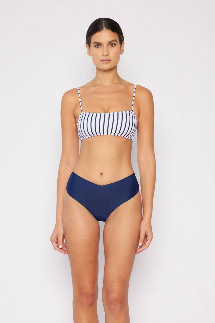 a woman wearing a bikini top and a bikini bottom