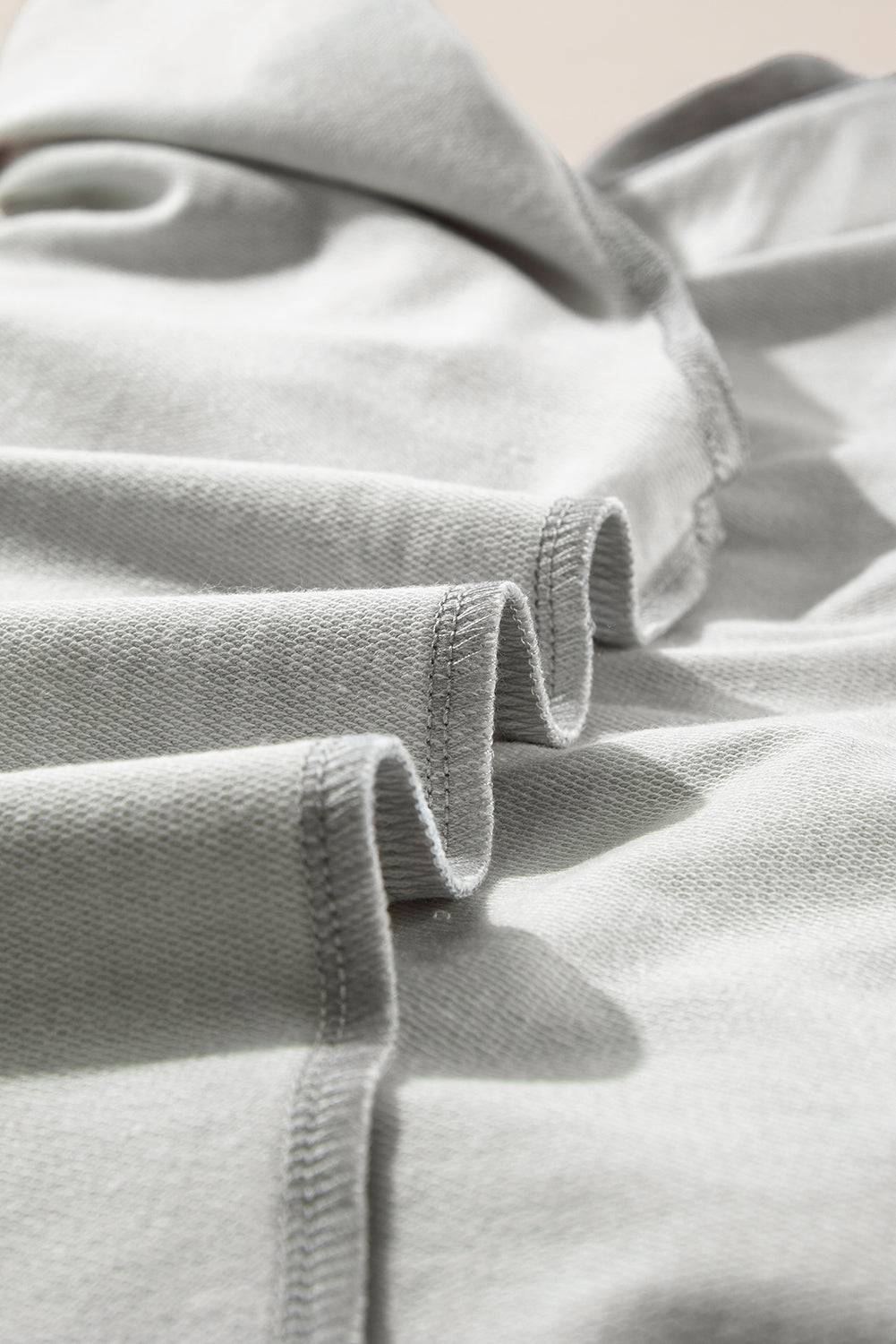 a close up of a bed with a white comforter