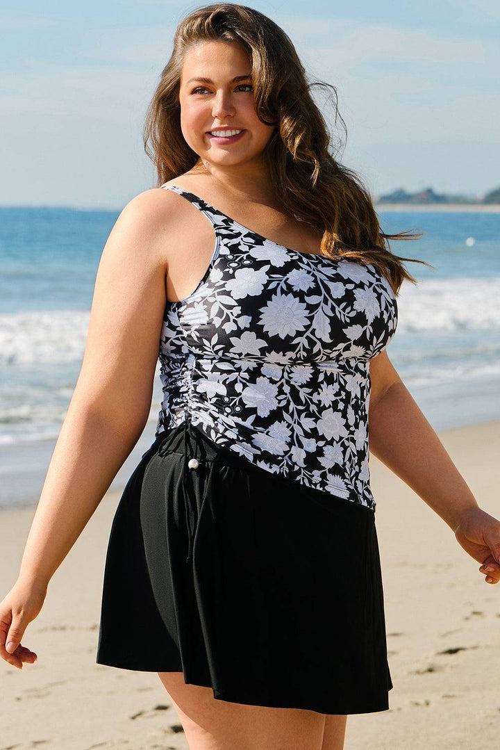 Side view of Black Plus Size Printed Square Neck Drawstring Ruffled Tankini Set featuring ruched sides and boho style. Shop now at Faith & Co. Boutique.