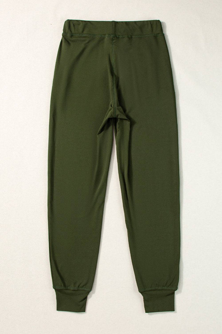 a pair of green pants with a white background