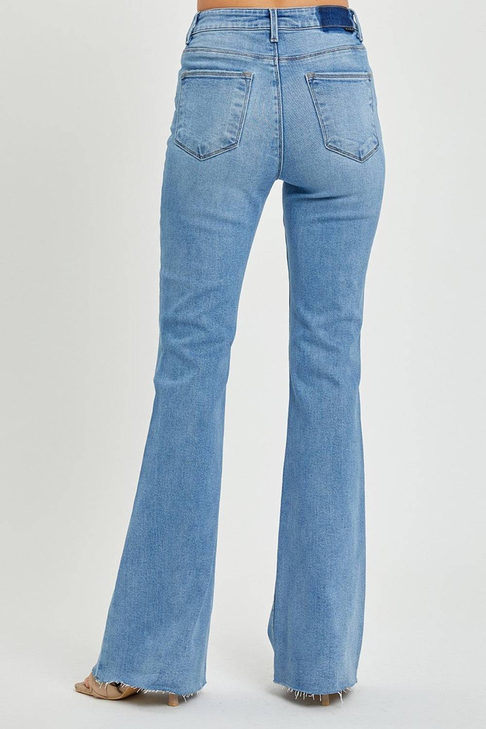 a woman is wearing a pair of blue jeans