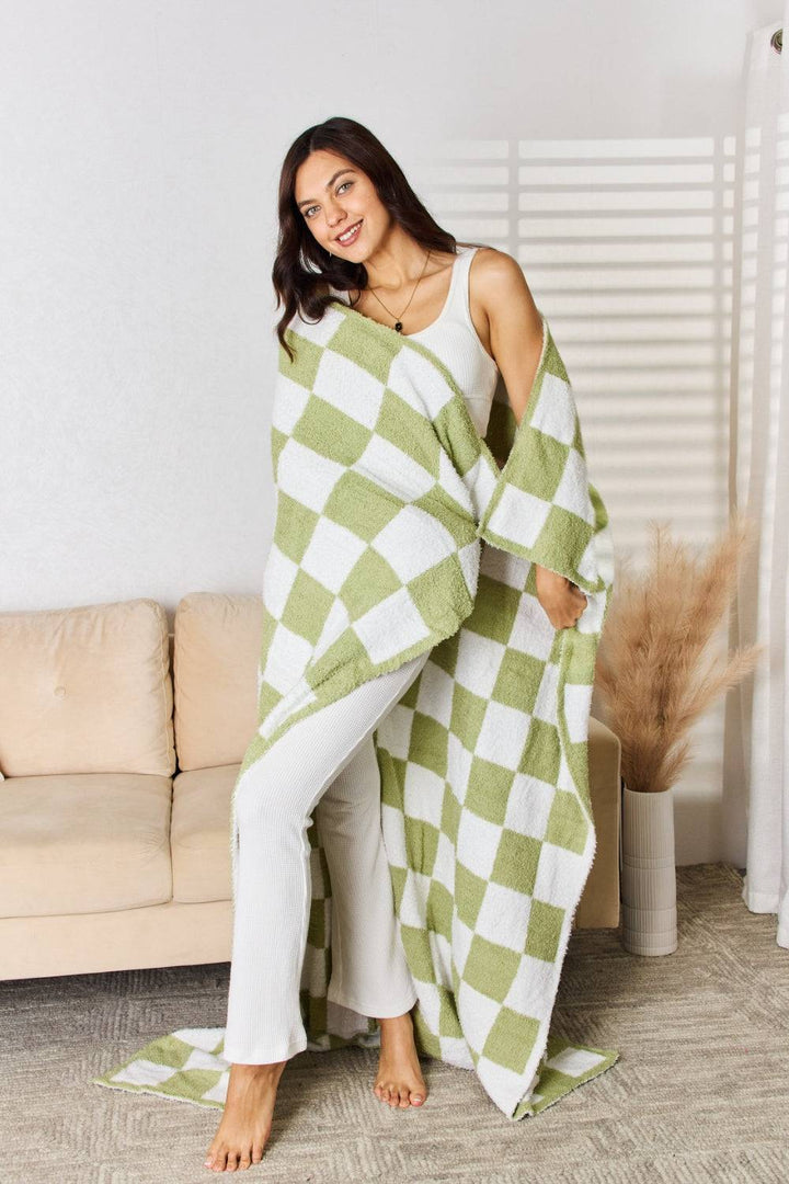 a woman in a green and white checkered towel