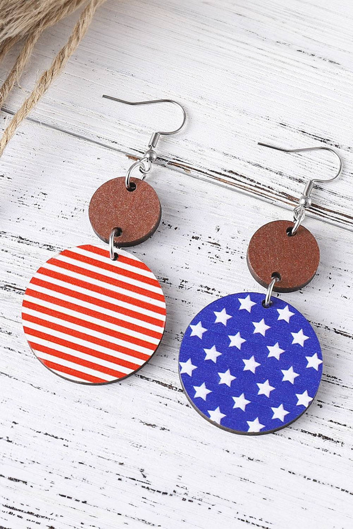 a pair of earrings with red, white and blue stars on them