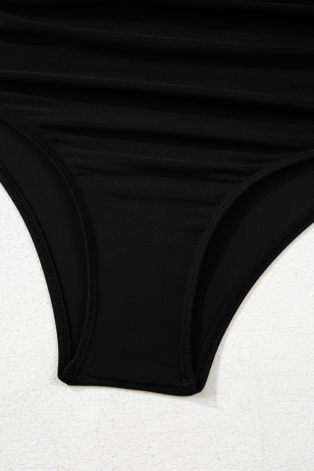 Bottom detail of Black Leopard 2-tone Crossed Cutout Backless Monokini showing high-waist design and smooth finish.